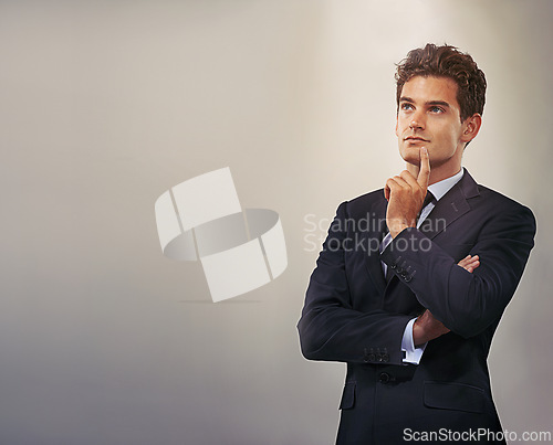 Image of Businessman, thinking and idea with decision or choice for solution or brainstorming on a gray studio background. Young man, model or employee in wonder, contemplating or thought on mockup space