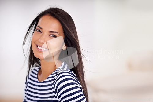 Image of Woman, portrait and happy in home on weekend, smile and satisfaction in living room for enjoyment. Female person, breeze and confident on mockup space, cheerful and wellness by peace or calm mindset