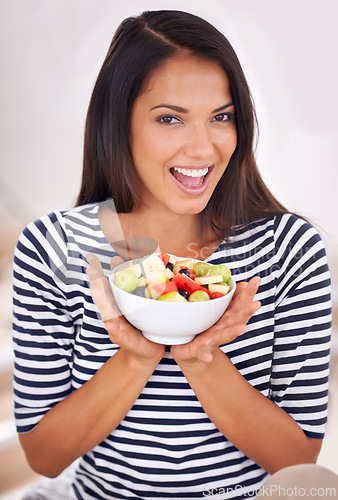 Image of Portrait, woman and fruit bowl with smile, natural nutrition and healthy organic food. Happy, female person with snack with vitamins for skin and body wellness, balance diet and excited vegan choice