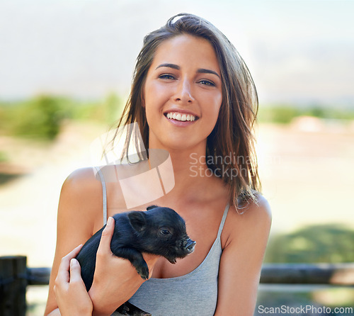 Image of Portrait, outdoor and woman with a piglet, happy and summer with weekend break and bonding together. Face, person and girl with animal and pet with sunshine and cheerful with joy, ranch and smile