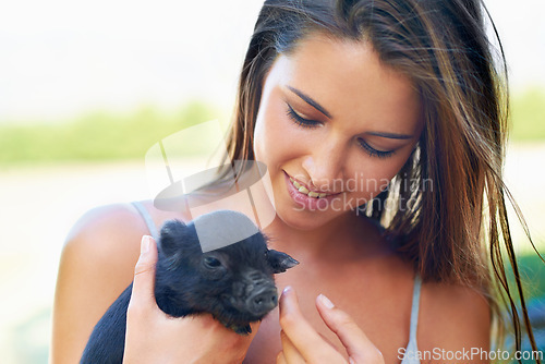 Image of Face, smile and woman with piglet on farm for agriculture or sustainability outdoor in Texas. Love, pet or summer and happy young person with baby pig in nature for livestock caring or nurture