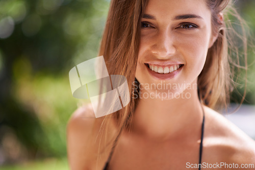 Image of Woman, closeup and portrait for summer vacation, holiday and adventure with swimwear. Bokeh, travel and face of female person at spa hotel for relax, getaway trip and weekend break outdoor in bikini