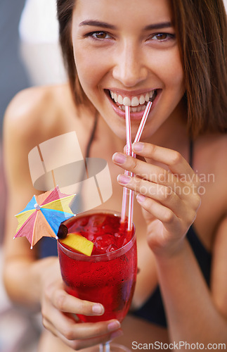 Image of Portrait, woman and smile with cocktail for drinking, refreshment and fun at resort. Happy female person, beverage and alcohol or liquor to relax on holiday, vacation and travel in Puerto Rico