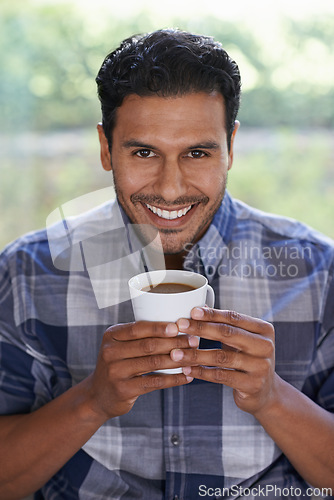 Image of Man, portrait and coffee to relax in home, smile and satisfaction with hot beverage on weekend. Male person, happy and latte or comfortable in apartment, morning and routine cup of tea for peace