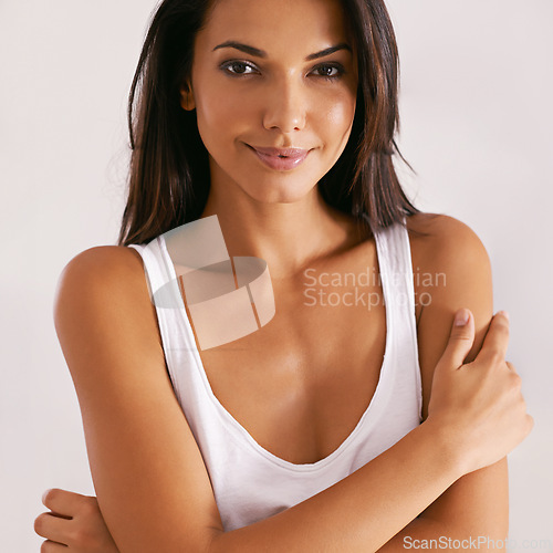 Image of Portrait, beauty and smile with tank top woman in studio isolated on white background for casual comfort. Face, pajamas and cosmetics with happy young person in casual clothing vest to relax