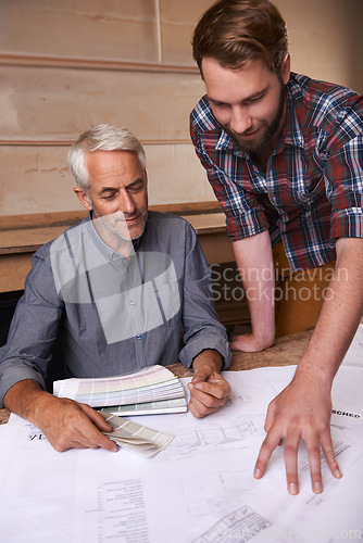 Image of Architects, collaboration and men with blueprint in office for building, construction or repairs. Engineering, design and industrial apprentice planning and working on industry project with mentor.