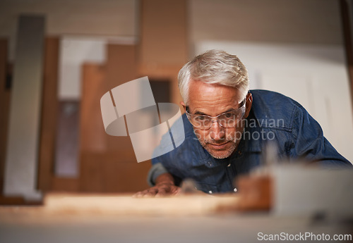 Image of Carpenter, thinking and planning in workshop, safety and glasses in small business. Design, woodwork or production with lumber or timber, contractor and materials or tools for furniture building