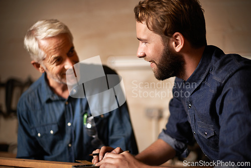 Image of Man, job and smile with wood, workshop and family business or apprenticeship. Father, adult son and design with artisan, carpentry and together for startup and mentor or learning with happiness