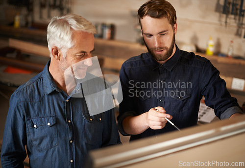 Image of Brainstorming, discussion and architects by board in workshop for industrial carpentry project. Planning, engineering and male industry apprentice working on ideas with mentor in office on site.