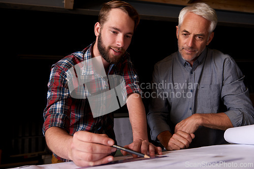 Image of Architects, discussion and men with blueprint in office for building, construction or repairs. Engineering, design and industrial apprentice planning and working on industry project with mentor.