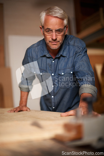 Image of Carpenter, thinking and planning in workshop, design and contractor in small business. Furniture, woodwork and production table with clamp for lumber or timber, safety glasses and materials or tools