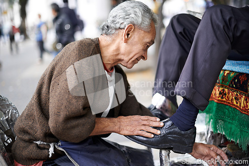 Image of Shine, shoes or old man in street, city or cleaning service for client or customer with polish or trade. Cloth, senior or feet of businessman in downtown Sao Paulo for footwear, job or outdoor help