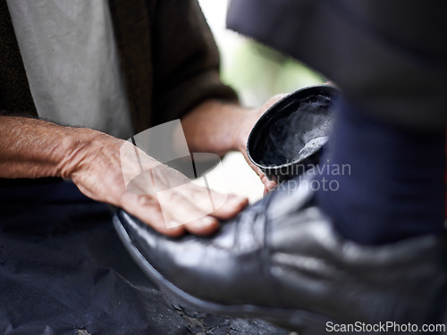 Image of Hands, repairman and polishing with leather shoes for customer in handcraft, startup business and store. Entrepreneur, shoemaker and service with client for footwear, skills and professional.
