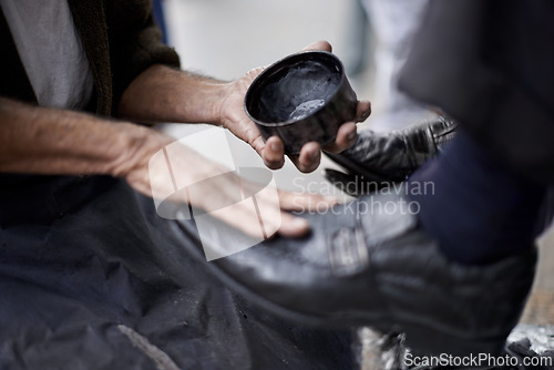 Image of Hands, repairman and polishing shoes for client in handcraft, startup business and store. Entrepreneur, shoemaker and service with customer for leather footwear, skills and professional in street