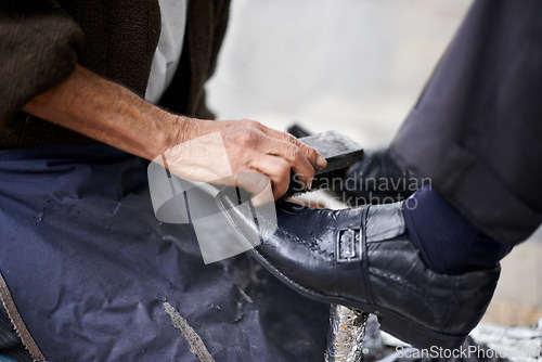 Image of Hands, repairman and polishing shoes for customer in handcraft, startup business and store. Entrepreneur, shoemaker and service with client for leather footwear, skills and professional in street