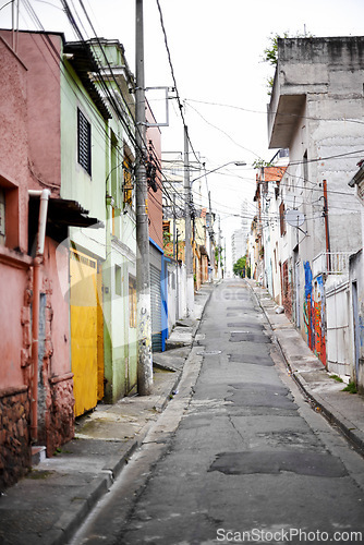 Image of Houses, barrio and street in city with architecture, color and slum with buildings on urban road. Neighborhood, favela and apartment with expansion, home and ghetto housing project in Sao Paulo