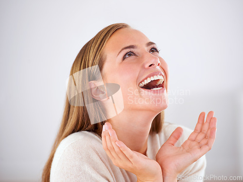 Image of Laughing, woman and happiness in studio with funny, comedy or reaction to humor in white background. Crazy, joke and girl giggle with joy from thinking of moment in comic or person with a smile