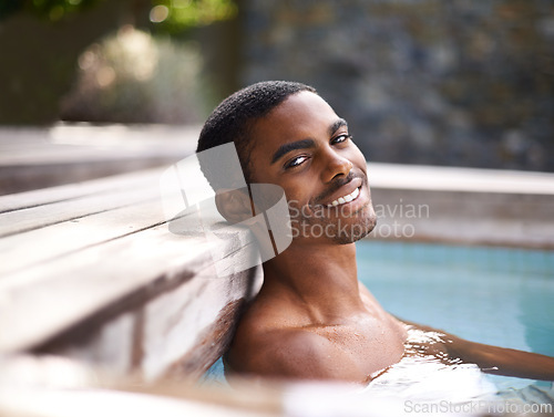 Image of Portrait, pool and water with African man smiling, vacation and holiday outdoors to relax in sunshine. Summer, swimming and happiness for body wellness, calm person and weekend entertainment