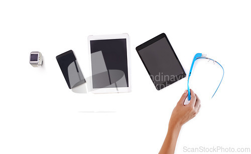 Image of Tablet, phone and white background for tech, digital and marketing as screen set for business. Person, display and advertise in studio, select and chosen for smart glasses and hand future technology