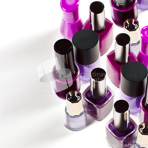 Image of Nail polish, purple and bottle on a white background for salon, cosmetics and beauty products. Cosmetology, luxury spa and container for painting nails for manicure, pedicure and pamper in studio