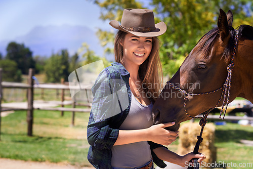 Image of Cowgirl, portrait and happy woman with horse at farm outdoor in summer or nature in Texas for recreation. Western hat, face or person with animal at ranch, pet or stallion in the rural countryside