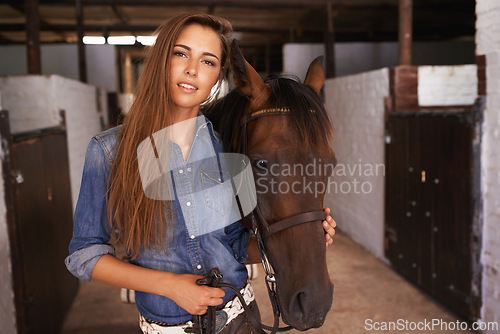 Image of Cowgirl, portrait and woman with horse at barn or stable in Texas for recreation. Western, animal and face of person at ranch with pet, livestock or stallion for hobby with care at equestrian farm