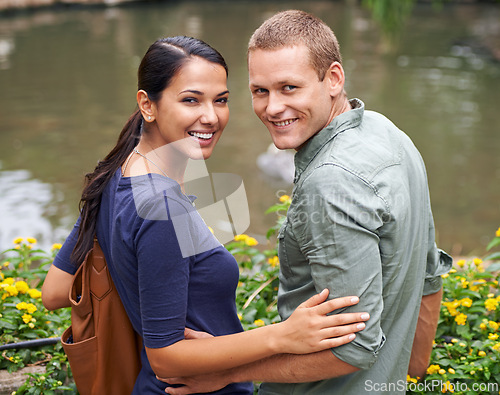 Image of Couple, hug and date or portrait at park, relationship and care on outdoor adventure or holiday. People, love and embrace on vacation and romance at sanctuary, zoo and calm or peace on weekend trip