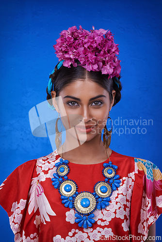 Image of Beauty, cosmetics and portrait of woman with aesthetic in blue background of studio with shine and glow of skin. Happy, girl and smile of female person with results of face routine for makeup