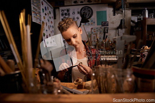 Image of Artist, woman and tools with woodwork in workshop with craftsmanship, knife and handmade design with creativity. Wood, carpenter or creative person at workspace with equipment for handicraft or hobby