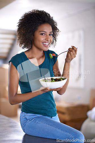 Image of Black woman, home and salad for wellness, eating and health in fitness and vegetable lifestyle. African female person, kitchen and healthy food for meal prep, happy and nutrition at house indoor