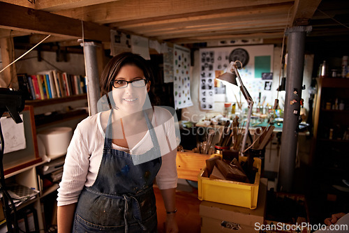 Image of Artist, workshop and portrait of happy woman in studio to work on creative sculpture or project at night. Artisan, workplace or person with pride or confidence as carpenter with talent and tools