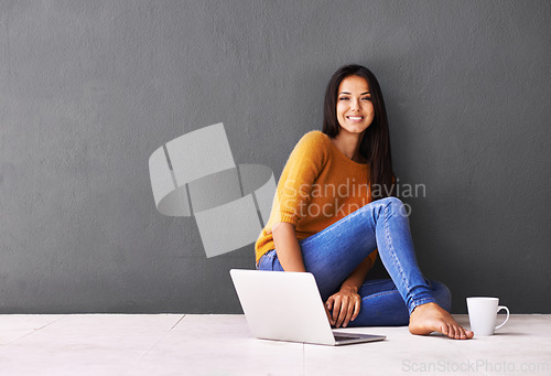 Image of Woman, laptop and portrait or coffee in home, web and cup of tea on floor of living room. Female person, mockup space and wall background for freelancer, planning and remote work in apartment on app