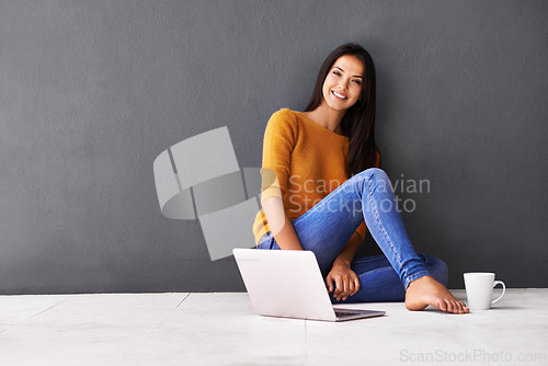 Image of Woman, laptop and portrait or tea in home, web and cup of caffeine on floor of living room. Female person, mockup space and wall background for freelancer, plan and remote work in apartment on app