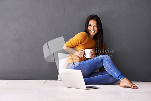 Image of Woman, laptop and portrait or cup in home, website and coffee or tea on floor of living room. Female person, mockup space and wall background for freelancer, plan and remote work in apartment on app