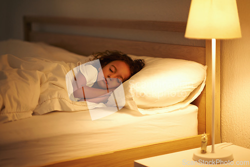 Image of Girl, sleeping and peace in bed at night, comfortable and tired or dream on pillow in home. Female person, child and resting in bedroom or lying to relax, exhausted and fatigue or peace and calm