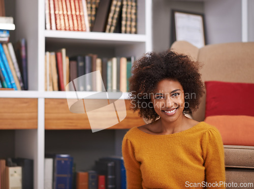 Image of Portrait, smile and African woman in library, floor and home study for reading or education. Books, novel and story for happy female with natural afro hair, learning and relax for knowledge or hobby
