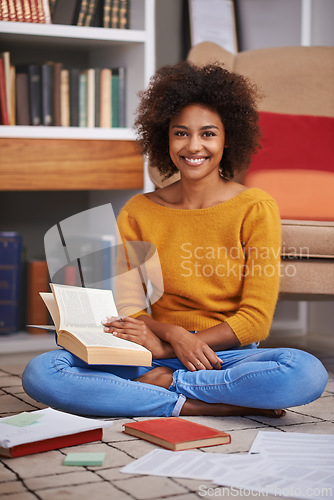 Image of Portrait, smile and African woman in library, floor and books for education. Textbooks, paper and study material for happy female student with natural afro hair, learning and notes for knowledge