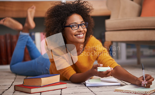 Image of Woman, portrait and library books with notebook or academic research paper, university education or scholarship. Female person, glasses and floor as student for exam learning, literature or project