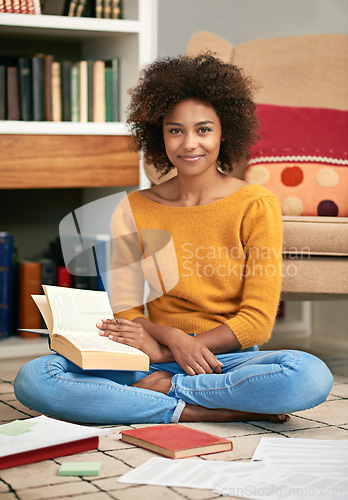 Image of Portrait, smile and happy student in home library, floor and studying for exam. Education, test and learning for university female scholar in London, knowledge and literacy with textbooks for notes