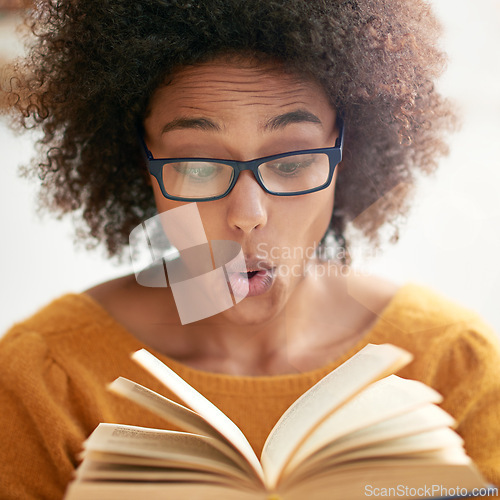 Image of Woman, book and reading or excited in library or literature knowledge or university education, story or information. Female person, glasses and shock learning or campus scholarship, school or college