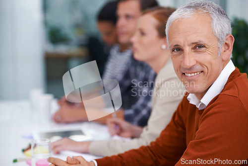 Image of Mature businessman, portrait and happy for training in seminar and meeting with coworkers in conference room. Accountant, positive or face in professional group or convention for finance or auditing