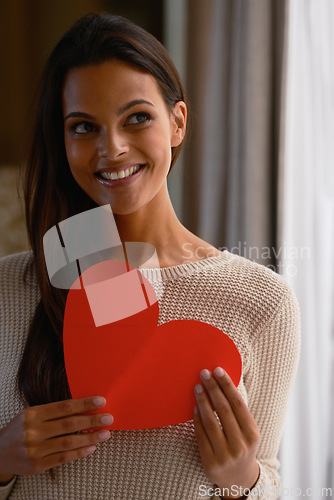 Image of Woman, smile and heart paper for kindness, care and love emoji for valentines day in home. Female person, happy and romance aesthetic or review and opinion, shape and icon for peace or compassion