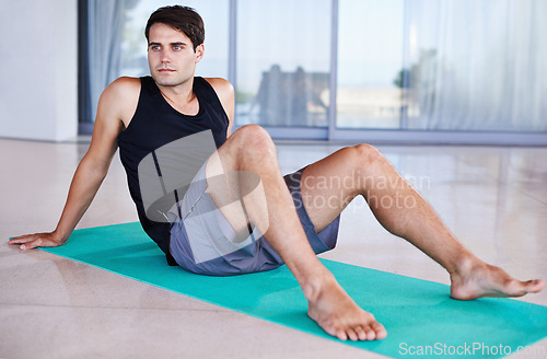 Image of Exercise, yoga and man relax before training, fitness and workout at sports center. Active, athlete and mindset or wellbeing for weight loss, health or pilates mat for outdoor gym and conditioning