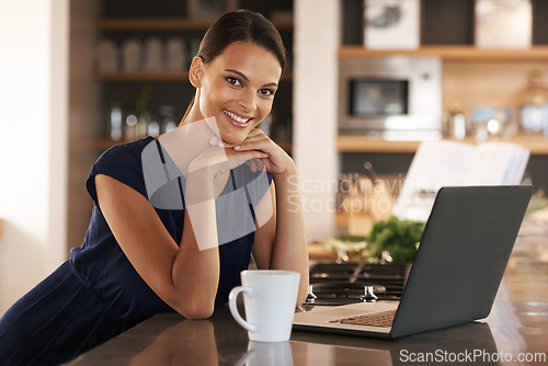 Image of Woman, portrait and laptop in kitchen with coffee for morning research as freelance journalist, online or remote work. Female person, face and mug in apartment for internet report, startup or drink