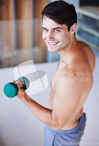 Image of Man, portrait and dumbbell for weightlifting, fitness and muscle training for body and self care. Topless athlete, exercise and endurance in workout at home for health, wellness and strength
