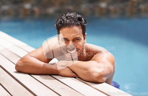 Image of Happy, portrait and man relax in pool on vacation in summer with happiness at hotel, resort or villa in Miami. Calm, holiday and person in water at deck in sunshine with smile from travel in Florida