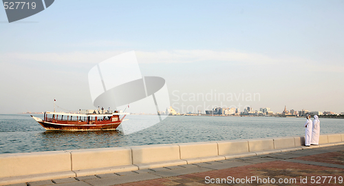 Image of Doha Corniche locals and boat