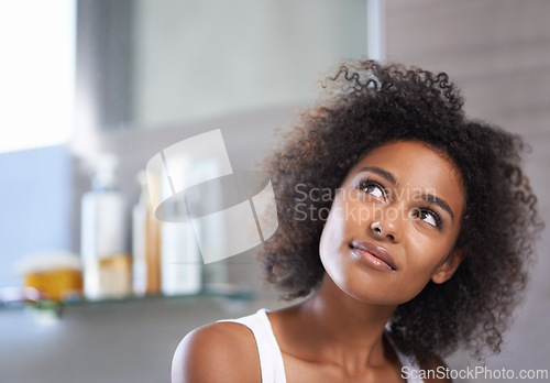 Image of African woman, bathroom and smile in morning with thinking, reflection and ideas in apartment. Girl, person and happy for memory with beauty, health and vision for insight, wellness and afro in house