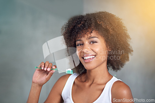 Image of Black woman, happy in portrait and toothbrush for teeth whitening in bathroom, dental health and self care for fresh breathe. Orthodontics, oral hygiene and morning routine with toothpaste at home