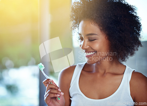 Image of African woman, toothbrush and smile in bathroom for oral wellness, health and benefits for mouth in home. Girl, person and teeth whitening with product, cleaning and toothpaste for results in house
